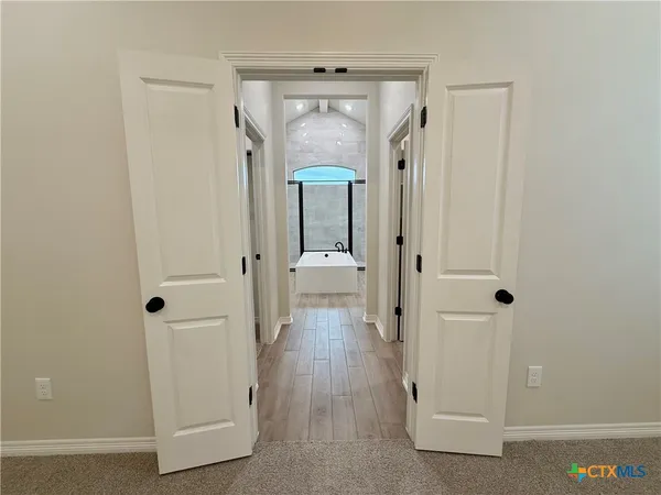 wooden floor with white walls