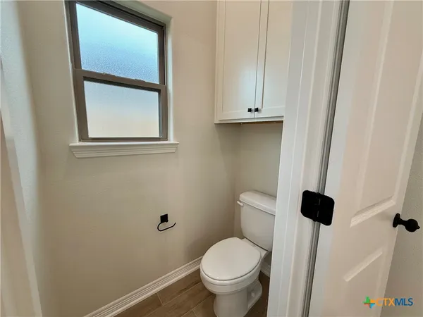 a bathroom with a toilet