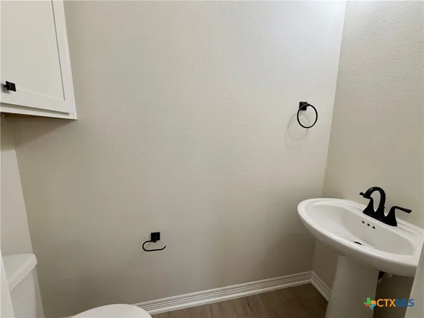a bathroom with a sink and mirror