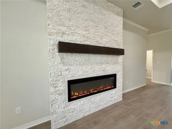 a living room with a fireplace