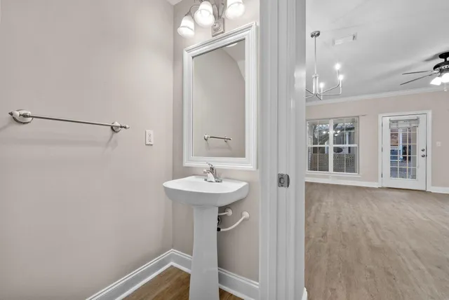 a bathroom with a sink a mirror and a shower