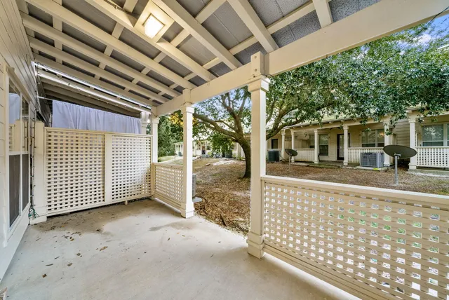 a view of a porch with wooden floor