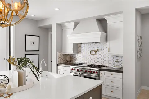 a kitchen with stainless steel appliances granite countertop a sink stove and cabinets