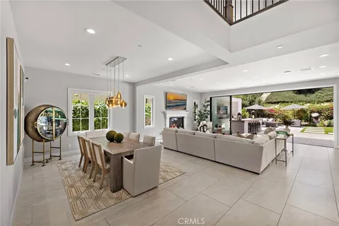 a living room with furniture a clock and a clock