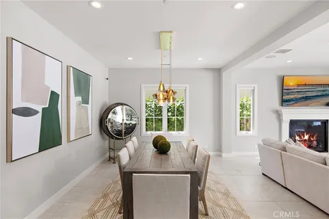 a living room with furniture a window and a fireplace