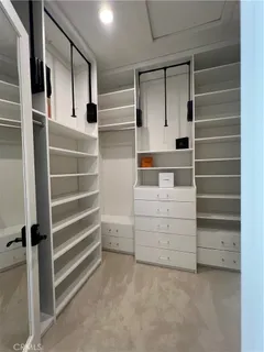 a bedroom with a bed and a lamp