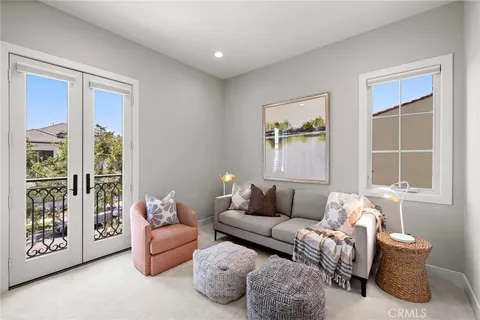 a bedroom with furniture and a window