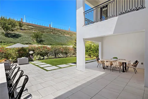 a view of dinning table and chairs in patio
