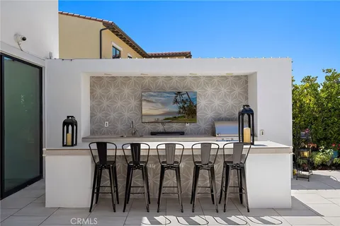 a view of backyard with outdoor seating and green space