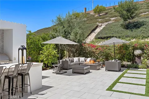 a view of a patio with couches and a table and chairs