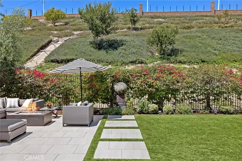 a view of house with a yard and garage