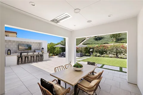 a outdoor dining space with furniture and garden view