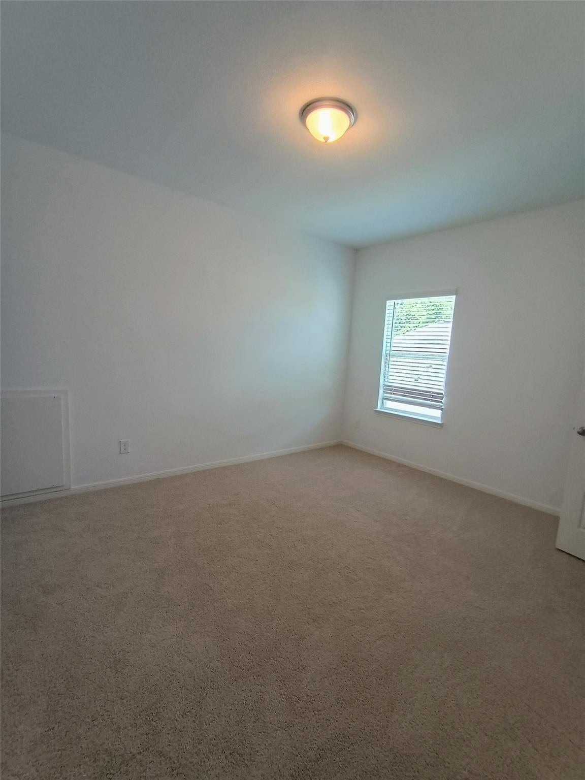 15924 Cy Young Court Splendora, TX 77372 - Photo 21 of 29 an empty room with a window