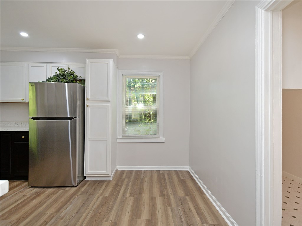 3517 Shawnee Avenue Anderson, SC 29626 - Photo 22 of 25 A streamlined kitchen corner features a stainless steel refrigerator and ample cabinet space.