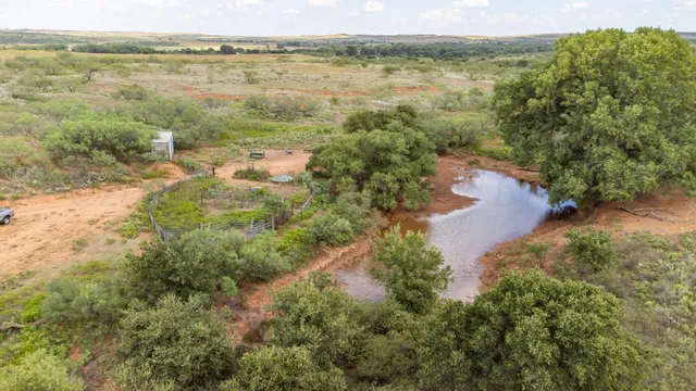 a view of lake with green space