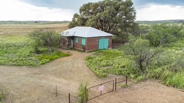 a view of a garden with an ocean view