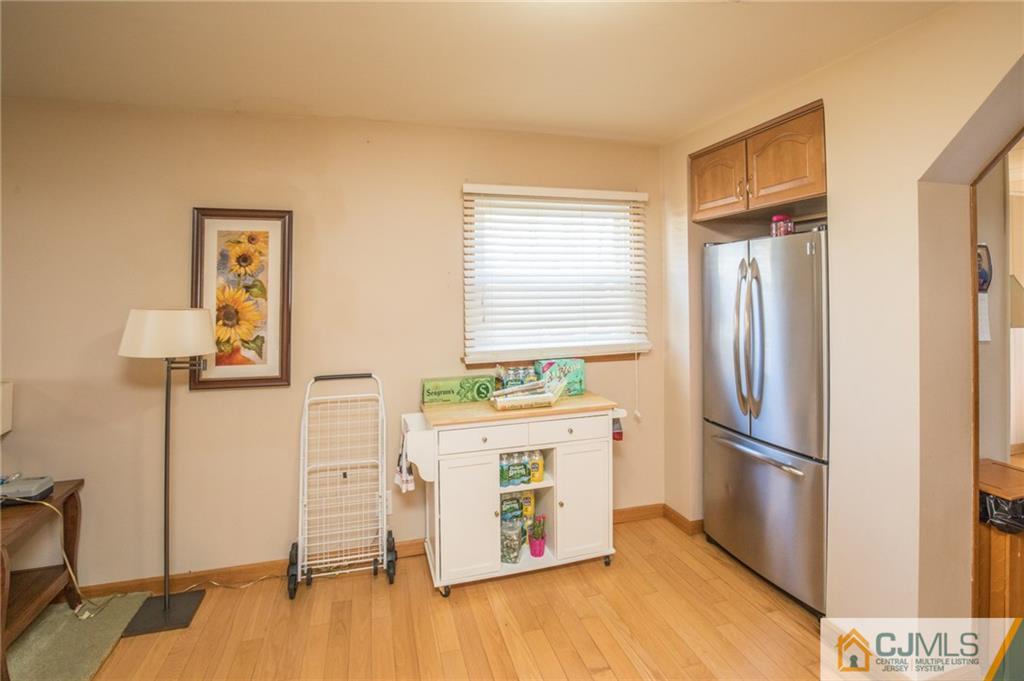 48 Caldwell Road Edison, NJ 08817 - Photo 15 of 24 a kitchen with a refrigerator and a stove top oven