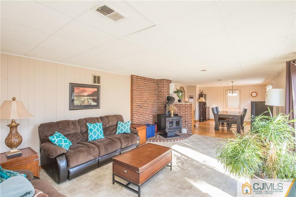 48 Caldwell Road Edison, NJ 08817 - Photo 17 of 24 a living room with furniture and a large window
