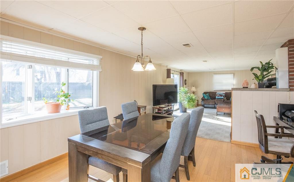 48 Caldwell Road Edison, NJ 08817 - Photo 20 of 24 a view of a dining room with furniture window and wooden floor