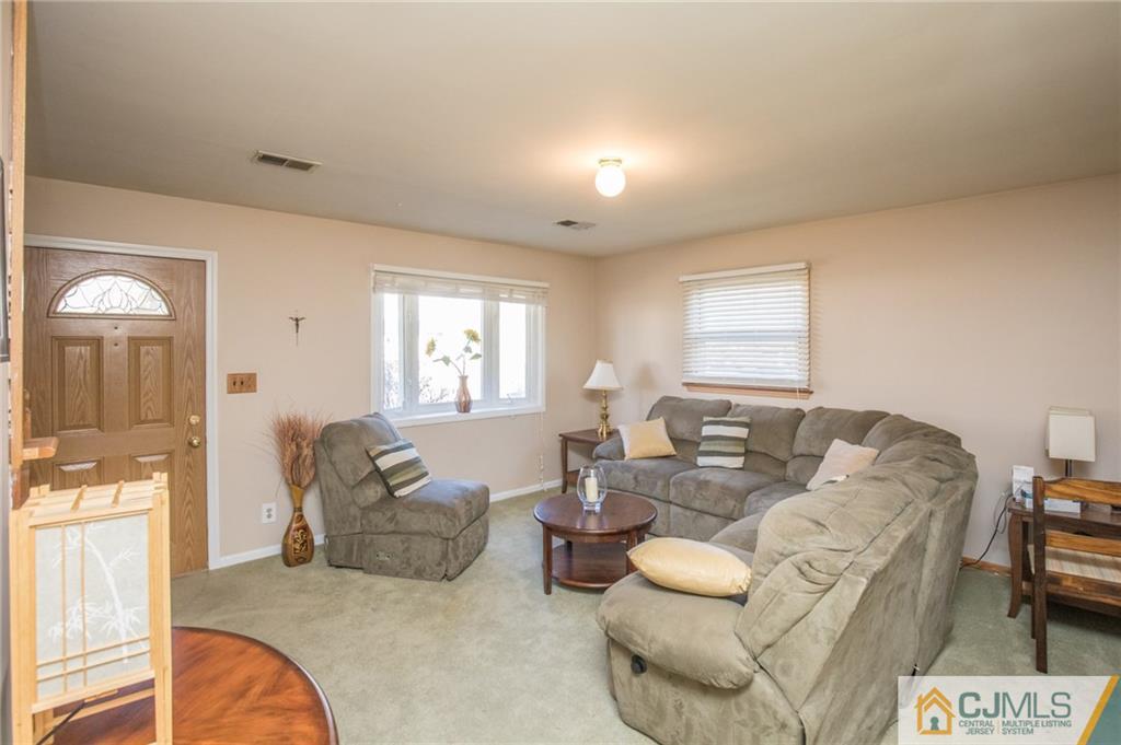 48 Caldwell Road Edison, NJ 08817 - Photo 4 of 24 a living room with furniture and a window