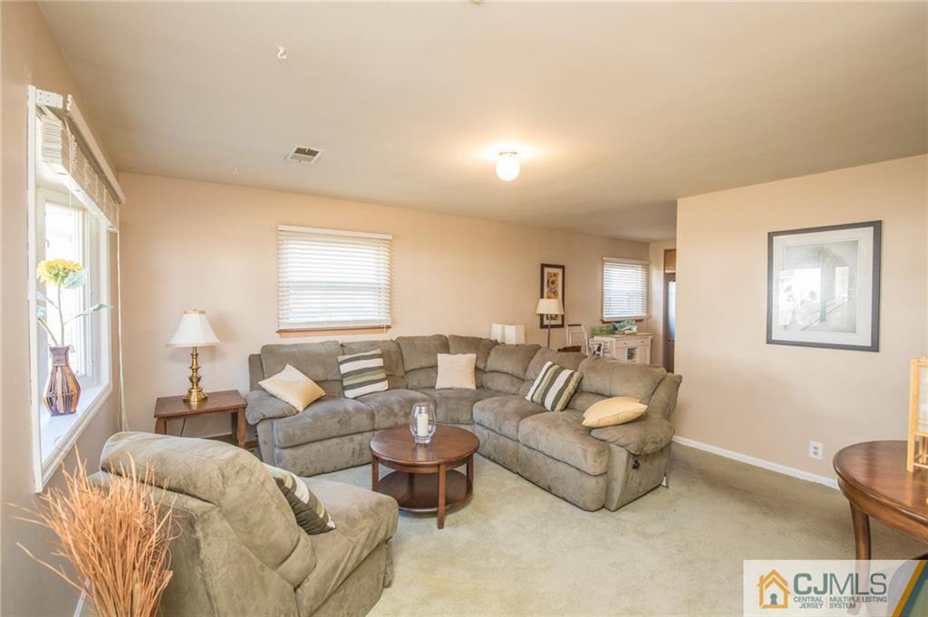 48 Caldwell Road Edison, NJ 08817 - Photo 5 of 24 a living room with furniture and a large window