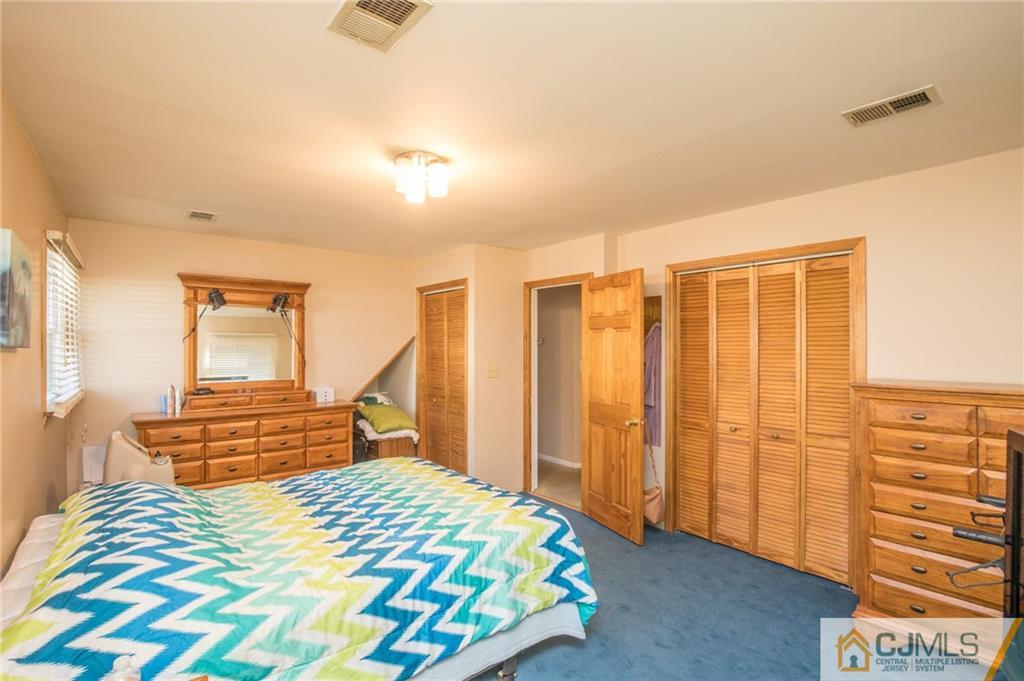 48 Caldwell Road Edison, NJ 08817 - Photo 7 of 24 a bedroom with a bed and wooden floor