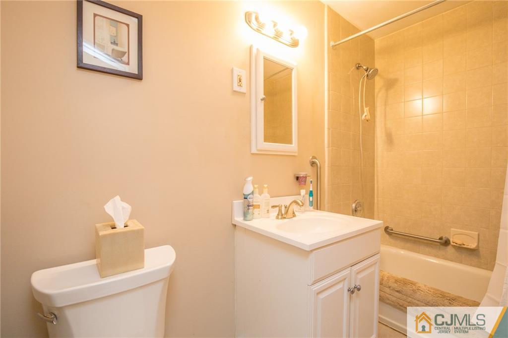48 Caldwell Road Edison, NJ 08817 - Photo 10 of 24 a bathroom with a sink and a mirror