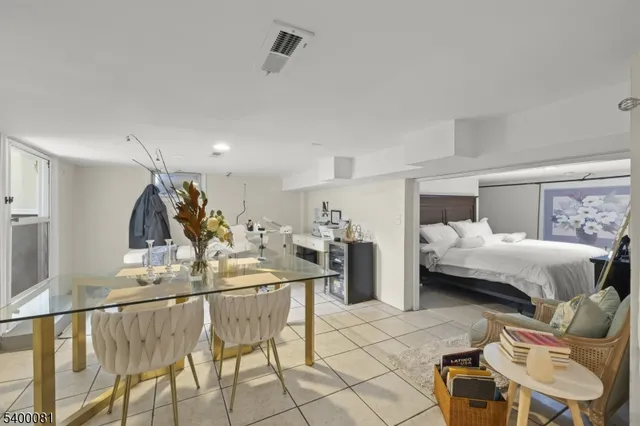 a living room with furniture and kitchen view