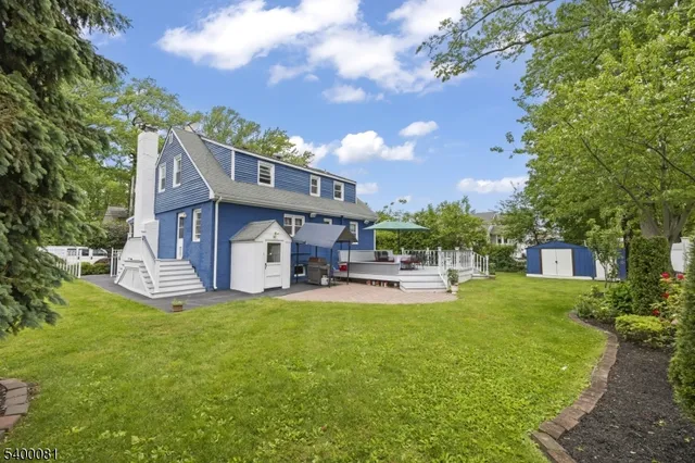 a view of a house with a yard porch and sitting area