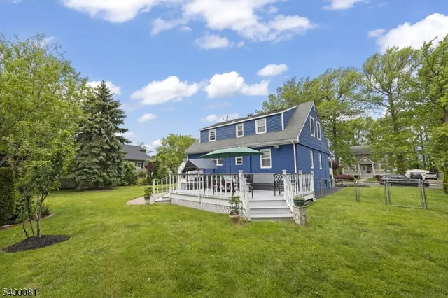 a view of a house with a yard porch and sitting area