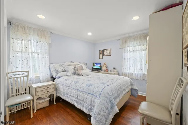 a bedroom with a bed and a chair