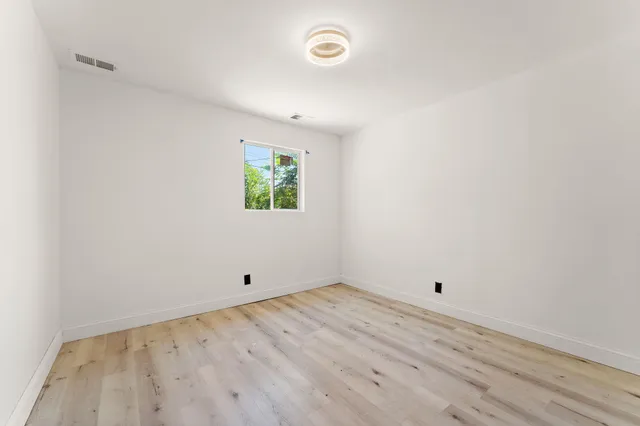 a view of room with window and ceiling fan