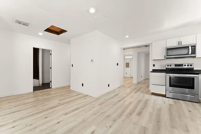 a view of kitchen with microwave and stove