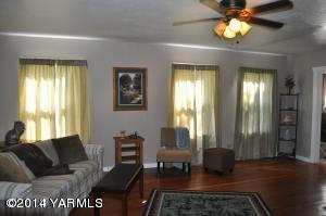 802 Estes Road Yakima, WA 98908 - Photo 13 of 26 a living room with furniture and a chandelier