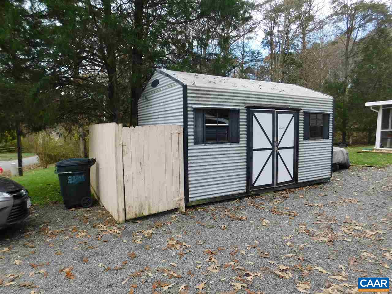 788 Carnation Road Ruckersville, VA 22968 - Photo 3 of 9 a view of a house with a large window and a yard