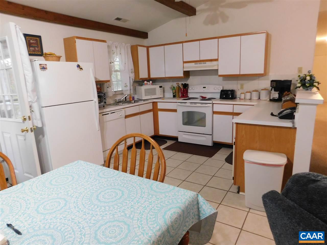 788 Carnation Road Ruckersville, VA 22968 - Photo 5 of 9 a kitchen with a refrigerator a sink dishwasher a stove a washer and dryer with wooden floors