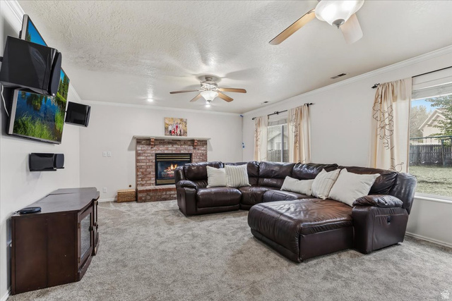 7975 Showcase Lane Sandy, UT 84094 - Photo 11 of 29 Family room offer a brick fireplace and large windows to backyard