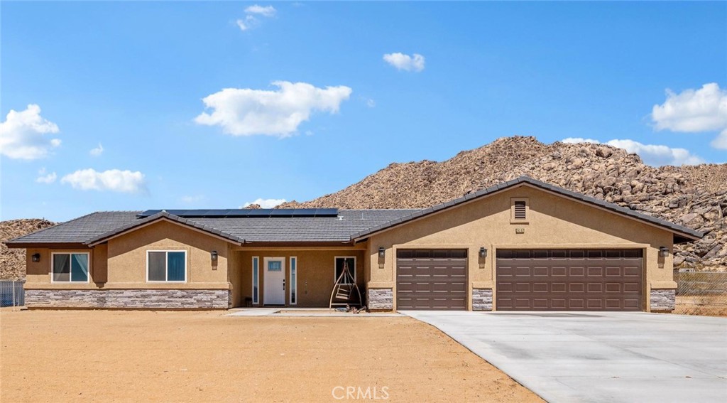 24162 Shoshone Road Apple Valley, CA 92307 - Photo 1 of 40 a front view of a house with a yard