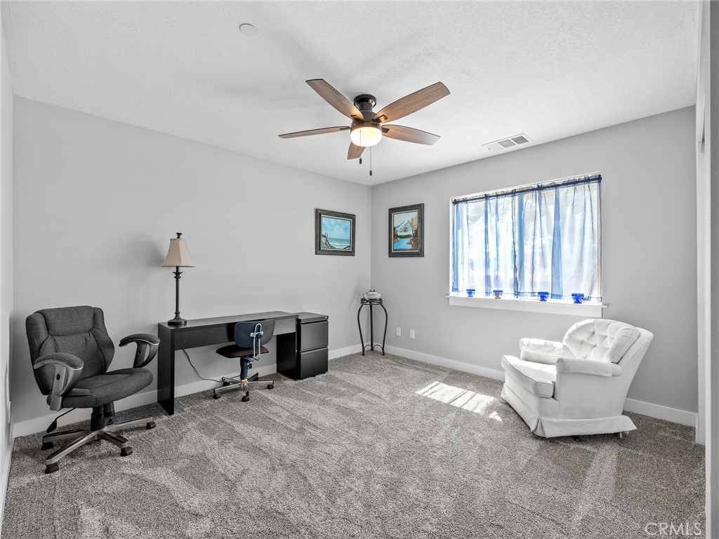 24162 Shoshone Road Apple Valley, CA 92307 - Photo 17 of 40 a living room with furniture and a window