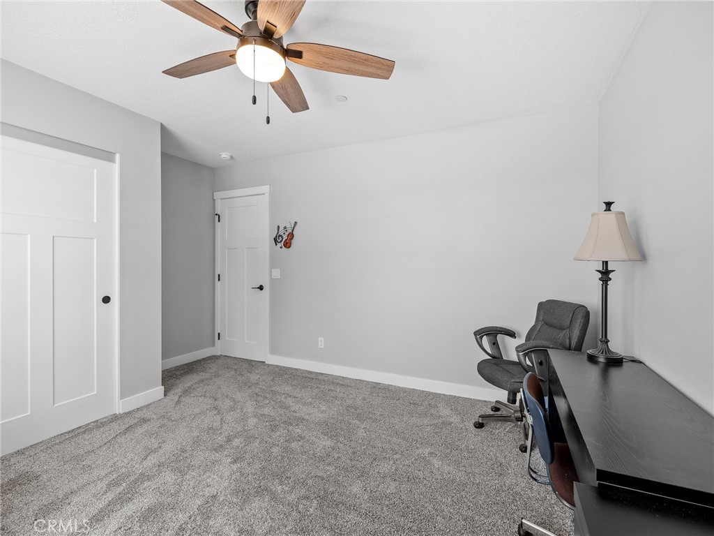 24162 Shoshone Road Apple Valley, CA 92307 - Photo 18 of 40 a view of a room with gym equipment