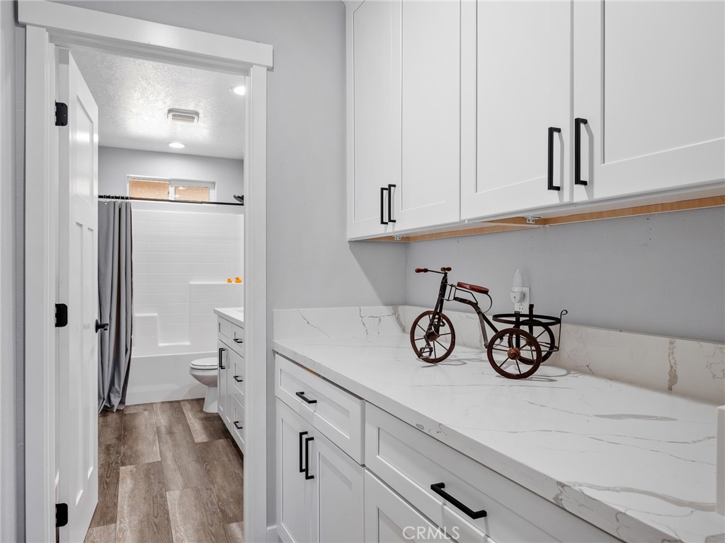 24162 Shoshone Road Apple Valley, CA 92307 - Photo 22 of 40 a view of a storage and utility room with closet clock