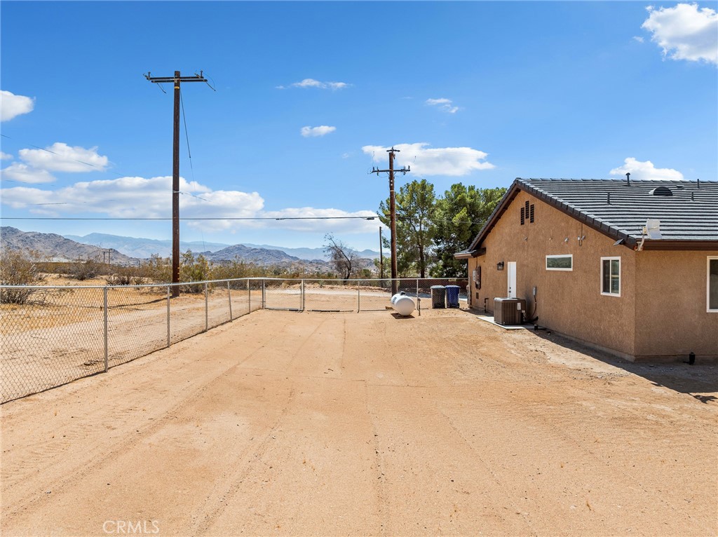 24162 Shoshone Road Apple Valley, CA 92307 - Photo 31 of 40 a view of a house with a terrace