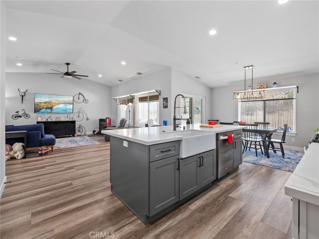 24162 Shoshone Road Apple Valley, CA 92307 - Photo 7 of 40 a kitchen with sink stove and cabinets