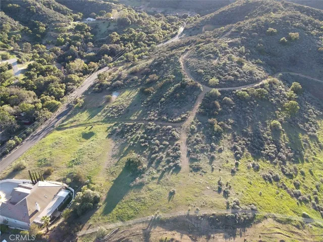 a view of a field with an ocean
