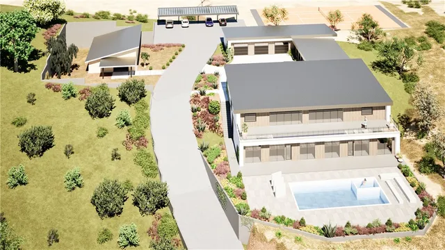 aerial view of a house with a yard