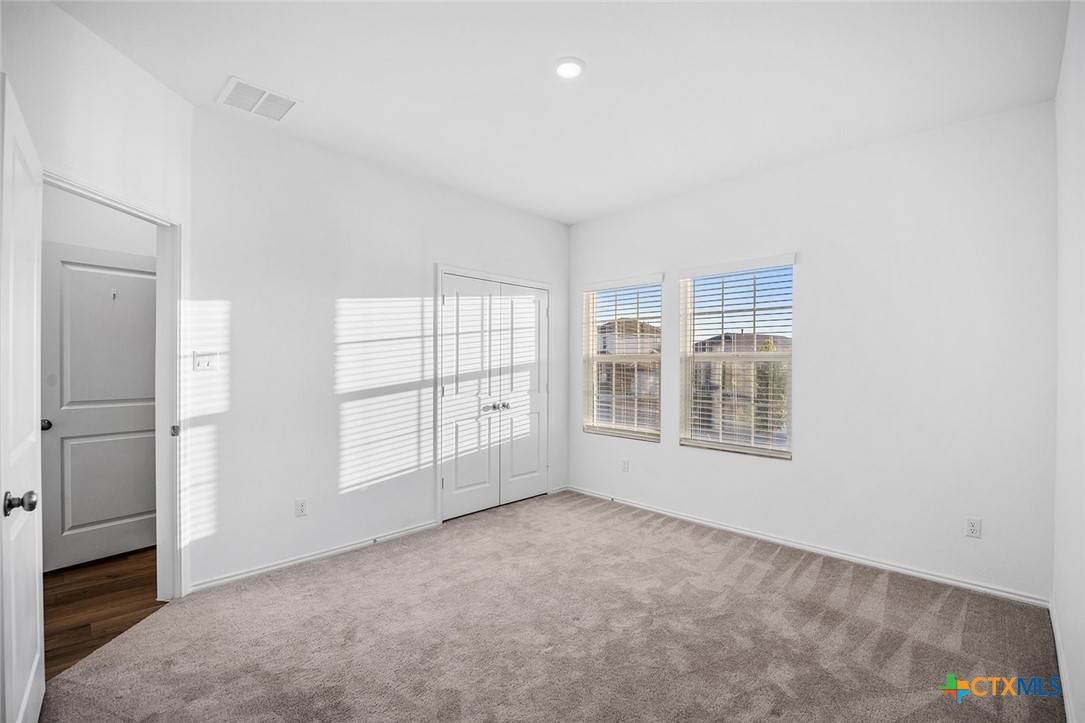 1909 Four Waters Loop Georgetown, TX 78628 - Photo 27 of 35 a view of an empty room with a window