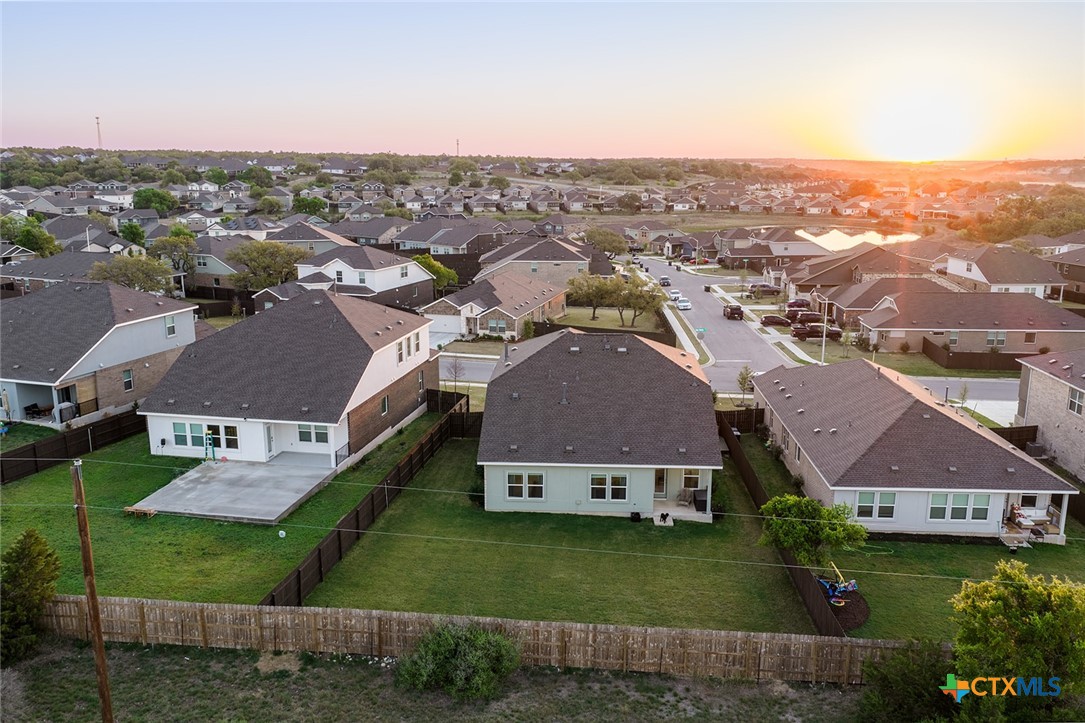 1909 Four Waters Loop Georgetown, TX 78628 - Photo 29 of 35 an aerial view of residential houses with outdoor space and city view