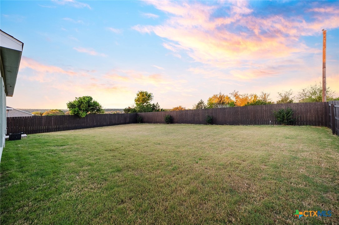 1909 Four Waters Loop Georgetown, TX 78628 - Photo 32 of 35 a view of an outdoor space and a yard