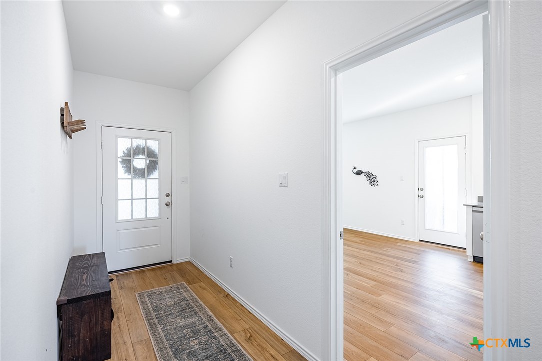1909 Four Waters Loop Georgetown, TX 78628 - Photo 6 of 35 wooden floor in an empty room