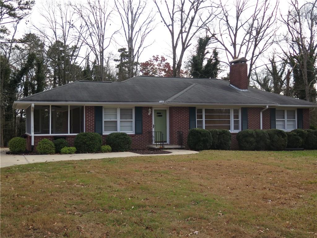 353 Mountain View Drive Northwest Gainesville, GA 30501 - Photo 1 of 8 a front view of a house with a yard
